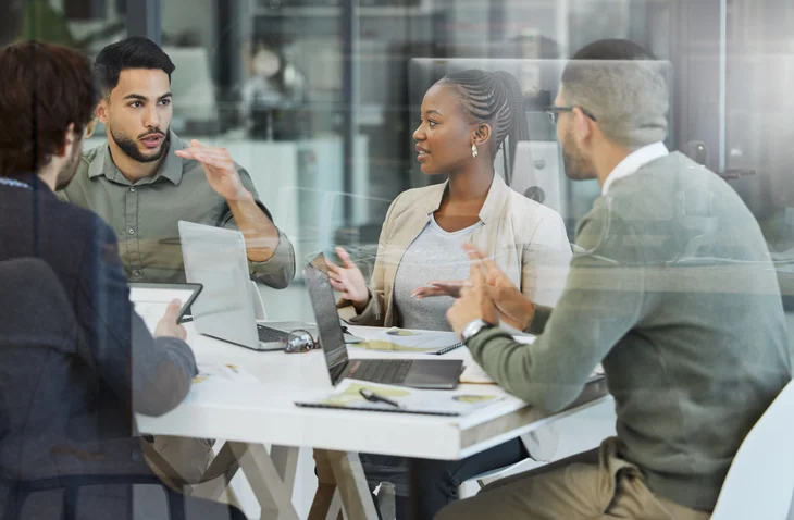 Shot of a group of businesspeople having a meeting in an office at work